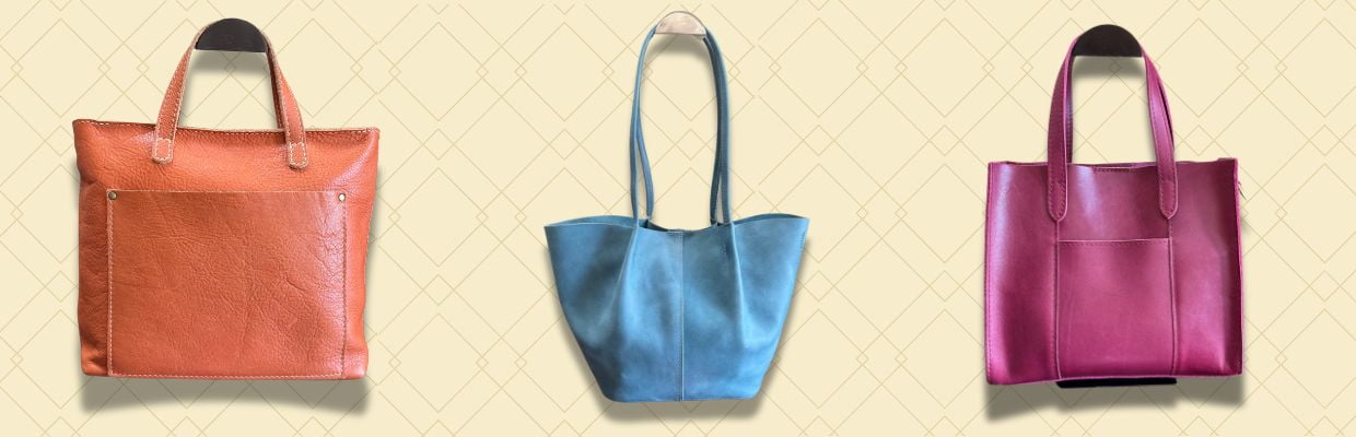 Three Portland Leather bags - Satsuma Medium Crossbody, Aqua Large Devan, and Boysenberry Lola, displayed in a row.